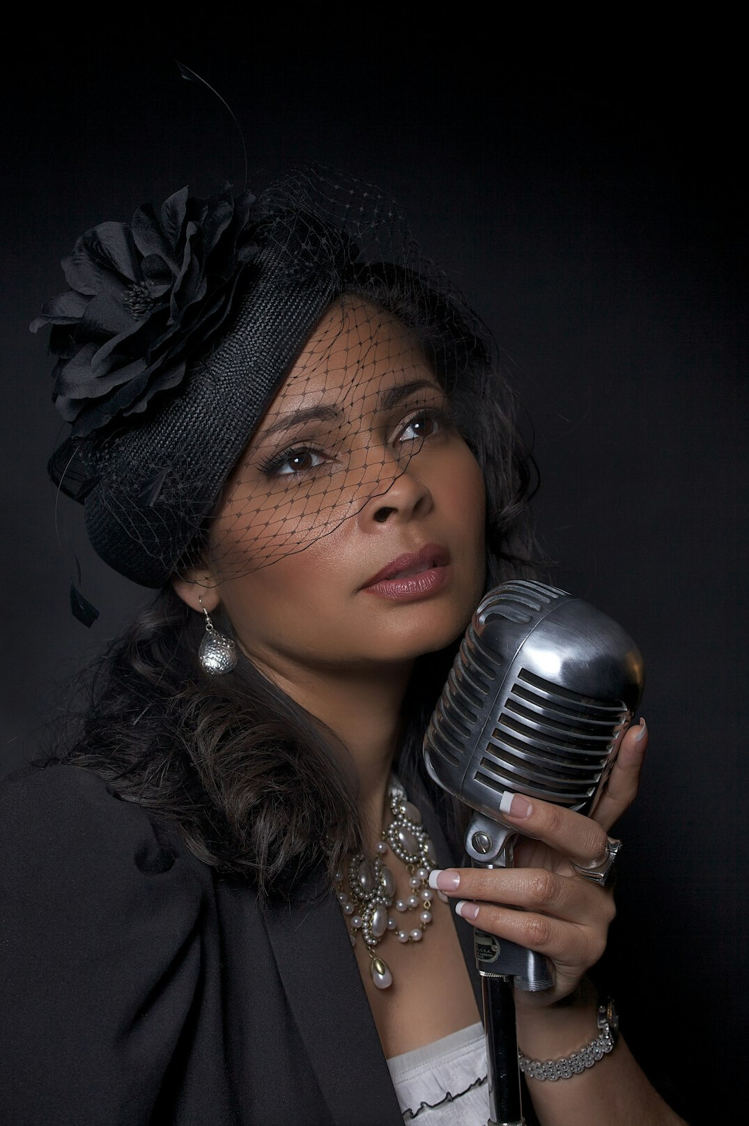 woman singing on stage